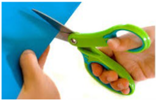 larger green handles scissors in right hand where thumb is in top handle, and all other fingers are in the bottom handle, cutting blue paper