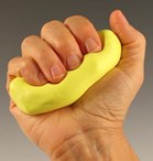 Grasp hand shape, pressing fingers down on ball of yellow putty